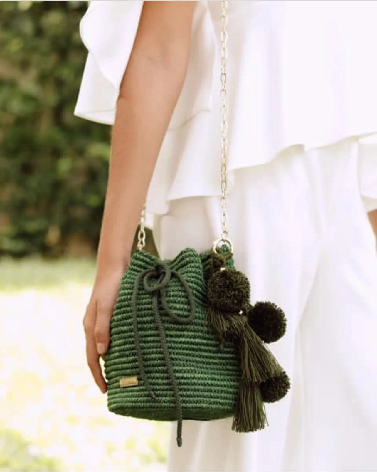 Bucket bag with Pom Poms